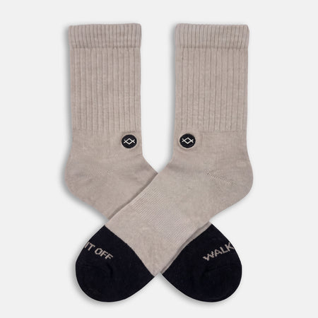 WALK IT OFF Merino sokken Biscuit – productfoto vooraanzicht met logo zichtbaar.
