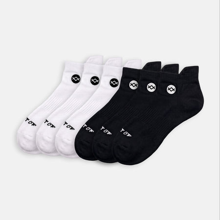 THE BASE - 6 PACK of Merino socks in a mix of black and white with 'WALK IT OFF' text.